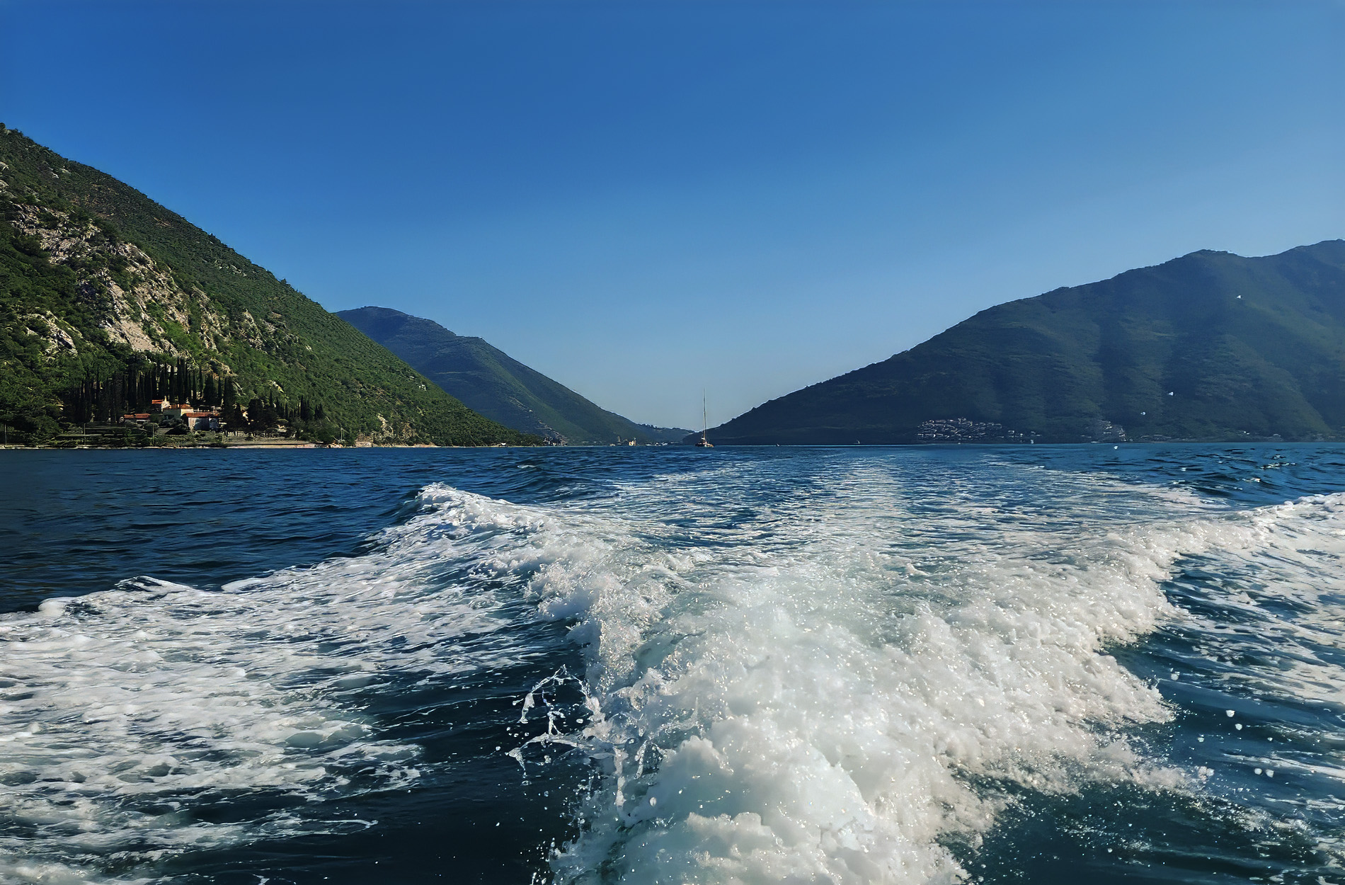 Cruising through the Bay of Kotor between mountains